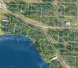 Half acre vacant lot in Baldwin, Lake CO. MI with views of Bush Lake! Rec capital of MI!