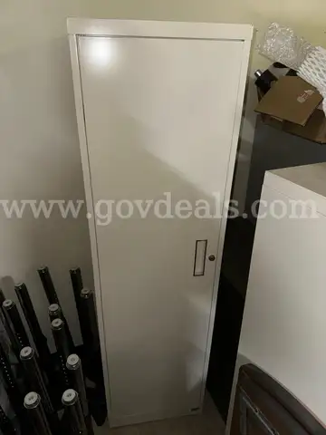 Free standing coat cabinet