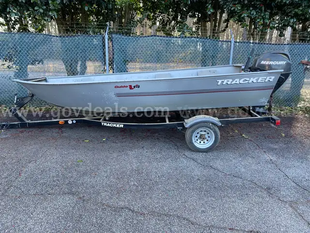 Tracker V-hull boat & trailer,  with 25 HP Mercury outboard motor