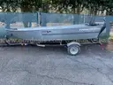 Tracker V-hull boat & trailer,  with 25 HP Mercury outboard motor