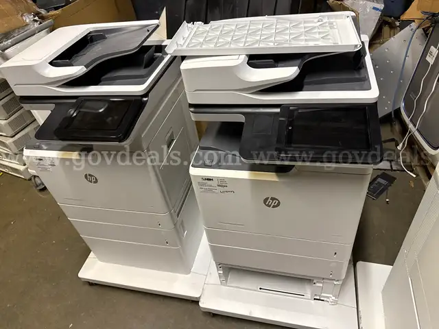 A lot of 2 HP Color LaserJet Managed MFP E67650dh Color Laser MFP