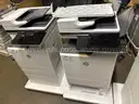 A lot of 2 HP Color LaserJet Managed MFP E67650dh Color Laser MFP