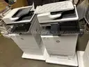 A lot of 2 HP Color LaserJet Managed MFP E67650dh Color Laser MFP