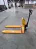 Pallet jack with intergrated scale