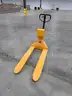 Pallet jack with intergrated scale