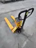 Pallet jack with intergrated scale