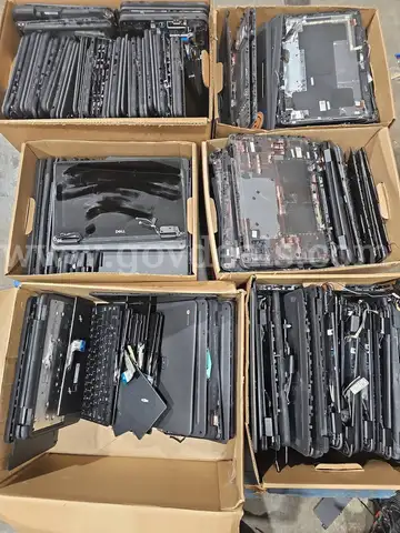 large quantity of assorted laptop parts.