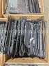 large quantity of assorted laptop parts.