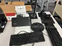 Lot of computers, monitors, keyboards, and misc computer items