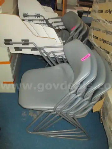 8 - stackable combination desks, which are school-style chairs with attached writing tablets