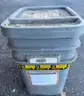 Bucket loaded with used metal chains with few locks very heavy