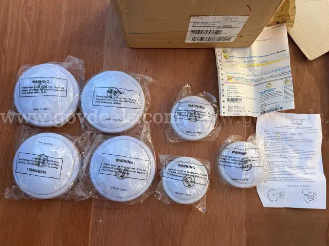 LOT OF 7 TAP LIGHT 4 LARGE AND 3 SMALL NEW IN BOX