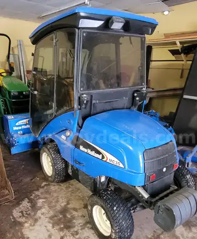 New Holland MC35 tractor with 72" mowing deck, 60" Snowblower and, Broom