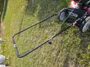 2 lawn mowers and Weed Eater