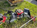 2 lawn mowers and Weed Eater