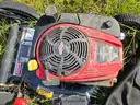 2 lawn mowers and Weed Eater