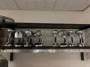 Lot of standing desk converters and office supplies