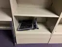Lot of standing desk converters and office supplies