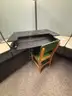 Lot of standing desk converters and office supplies