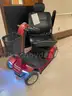 2 scooters and an electric wheelchair