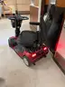 2 scooters and an electric wheelchair