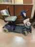 2 scooters and an electric wheelchair