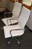 2 white chairs