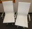 2 white chairs