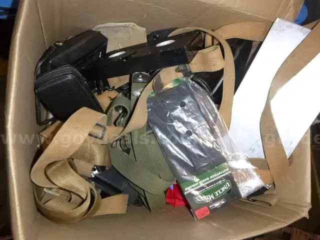 lot of old gear, equipment, rifle parts, slings, etc
