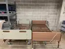 2 hospital beds without mattresses
