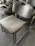 Lot of 124 Gray Stacking Chairs With 2 Dollies
