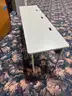 Long student tables with cord storage