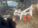 Bobcat S70 with 3&#x27; front bucket attachment and pallet fork attachment