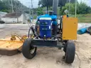 1999 New Holland 6610S with bush hog