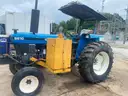 1999 New Holland 6610S with bush hog