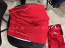 Various red and white women's adidas shorts