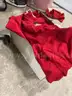Various red and white women's adidas shorts