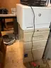 L-shaped desk, bookcase, small filing cabinet, and desktop printer