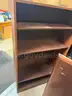 L-shaped desk, bookcase, small filing cabinet, and desktop printer