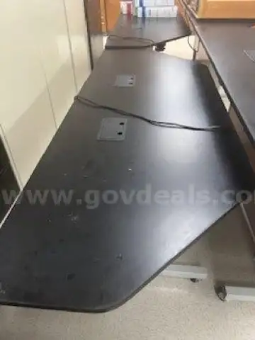 Lot of 8 tables - Eclipse Tables. Each table measures 8 feet by 3 feet and includes electric height-adjustment
