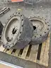 (4) SKID STEER TIRES AND WHEELS