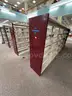 Lot containing various sizes, styles, and configurations library book and magazine shelving and book carts.