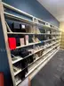 Lot containing various sizes, styles, and configurations library book and magazine shelving and book carts.