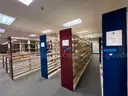 Lot containing various sizes, styles, and configurations library book and utility shelving.