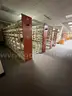 Lot containing various sizes, styles, and configurations library book and utility shelving.