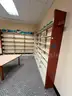 Lot containing various sizes, styles, and configurations library book and utility shelving.