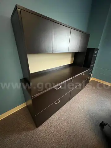 Complete office furniture suite featuring dark espresso laminate finishes.