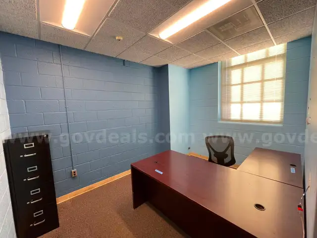 Lot containing office furniture, including an L-shaped desk, metal file cabinet, and office chair.