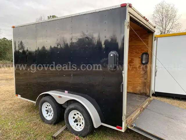 2004 Caroline enclosed cargo trailer 7' W x 12' L x 7' H, in poor condition.