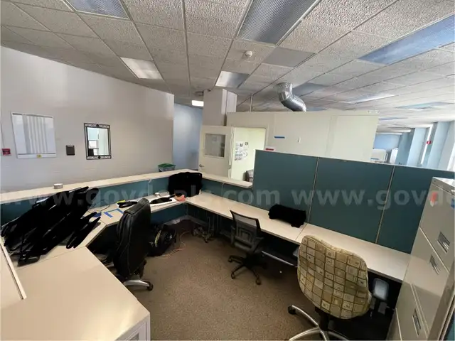 Lot containing (4) office cubicles with workstations, storage, and filing cabinets.